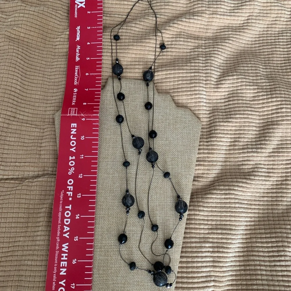 Long elegant black necklace with net over glass beads